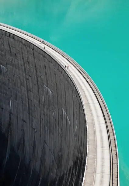 Photo of People walking on edge of Stausee Mooserboden Dam, Kaprun, Austria