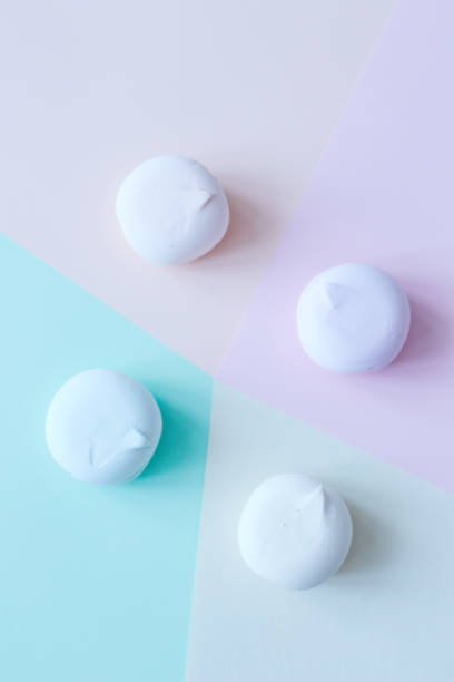 istock Bright and beautiful multi-colored desserts on pastel backgrounds Macaroons. Marshmallows. delicious breakfast. Beautiful healthy food. Background. Atelier 1297205322