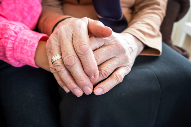 istock Grandma and grandchild holding hands 1297205768