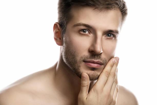 istock Young and handsome man with smooth skin on white background 1297205772