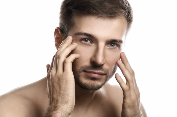 istock Young and handsome man with smooth skin on white background 1297205820