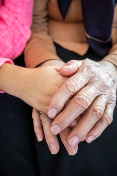 istock Grandma and grandchild holding hands 1297206005