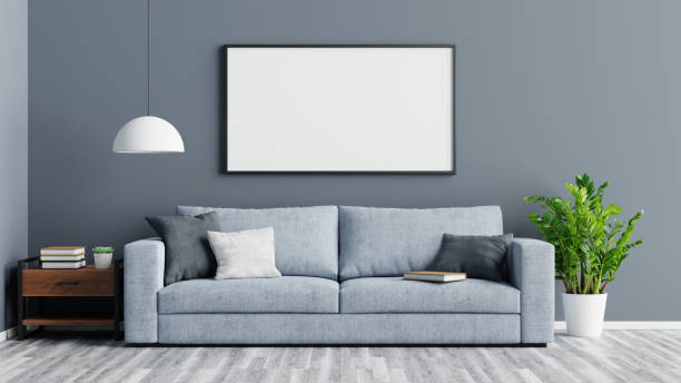 istock Empty frame, wooden table and sofa in living room, 3d rendering 1297207122