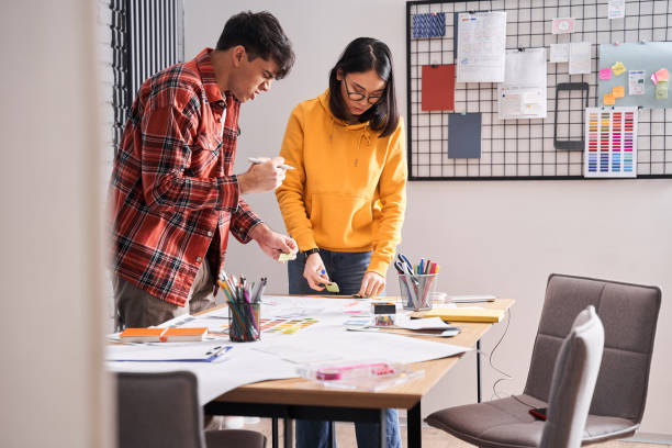 istock Designers putting on the table icons 1297207440
