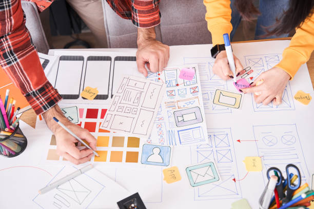 istock Designers drawing the application on paper 1297207454