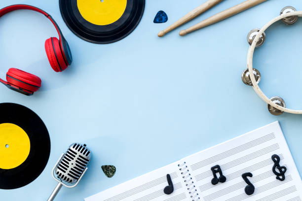 Music flat lay - instruments with vinyl records, overhead view