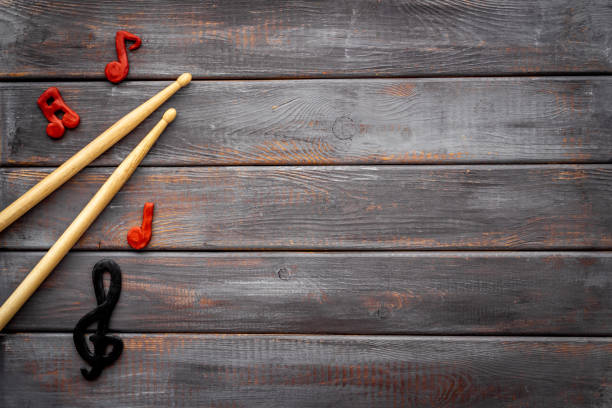 istock Drum sticks with music notes, overhead view. Music background 1297208868