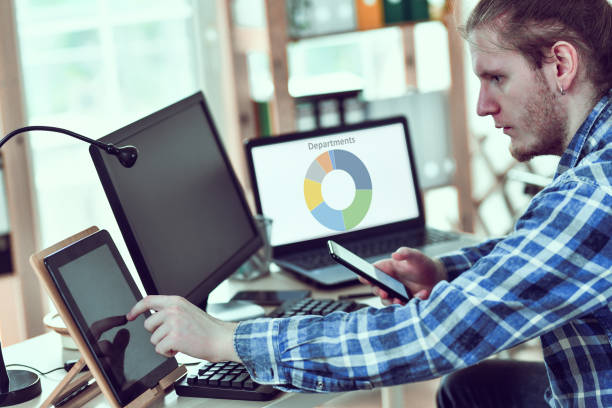 istock Stressed Male Trying To Finish Work For The Day In Office 1297209807
