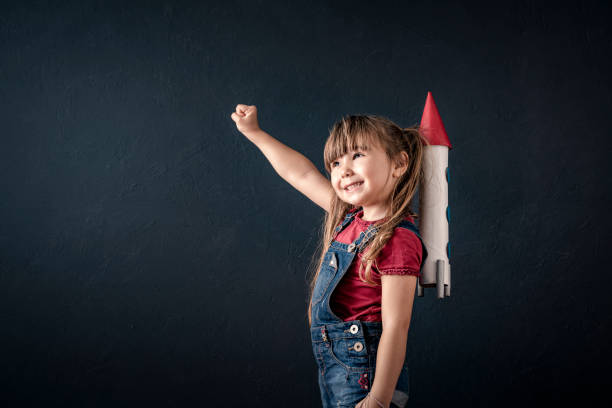 istock Young Business Girl with Rocket Pack 1297209826