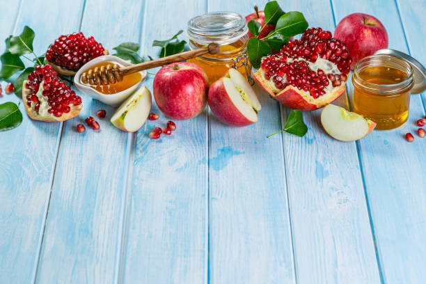 istock Rosh hashanah concept - honey, apples, pomegranate, symbols 1297210027