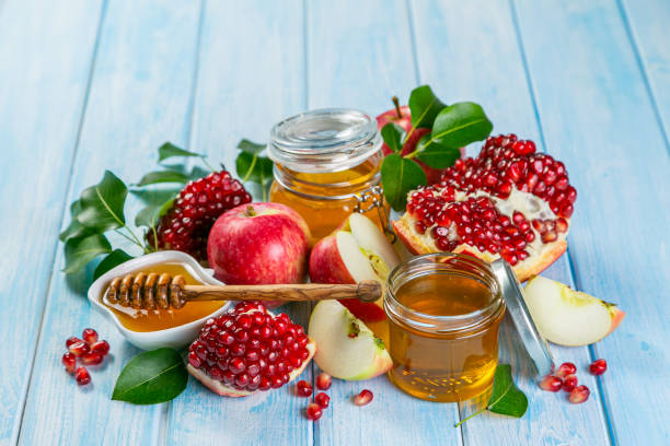 istock Rosh hashanah concept - honey, apples, pomegranate, symbols 1297210028