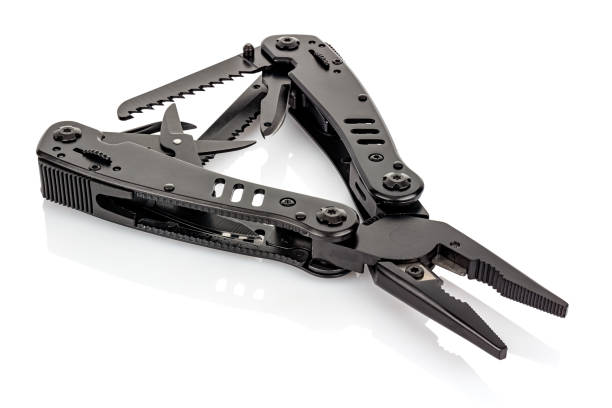 Opened black survival multifunctional knife with various tools isolated on white background