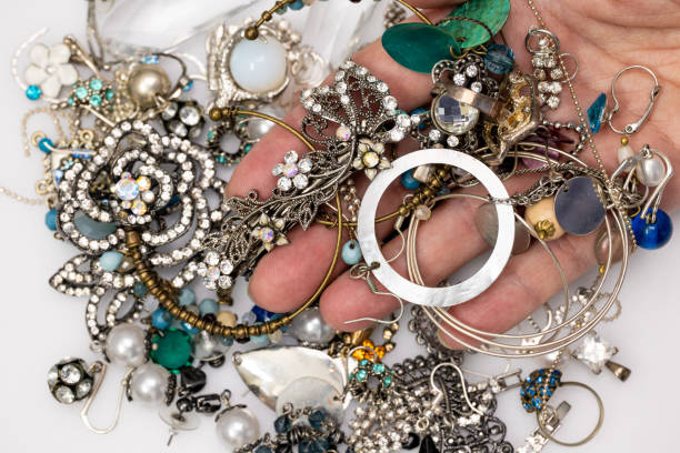 istock Female hand holding jewelry 1297212364