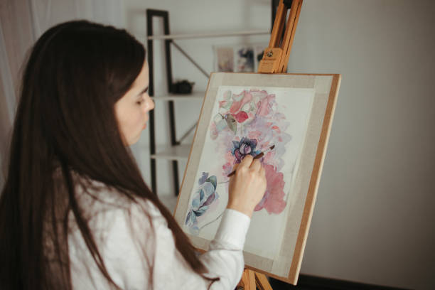 istock Watercolor painting. Artist at work 1297213320