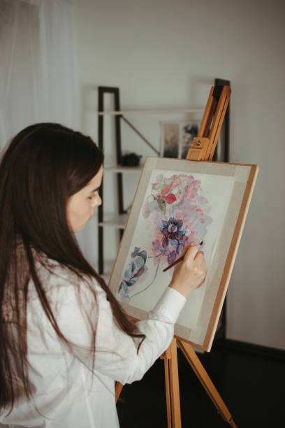 istock Young woman do easel drawing, creative hobby 1297213341