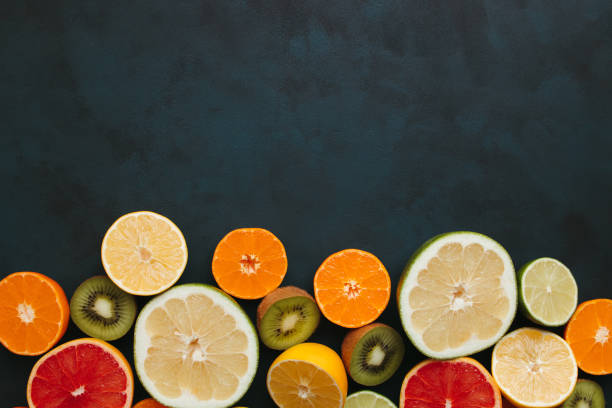 istock Summertime tropical background with exotic fruits 1297213362