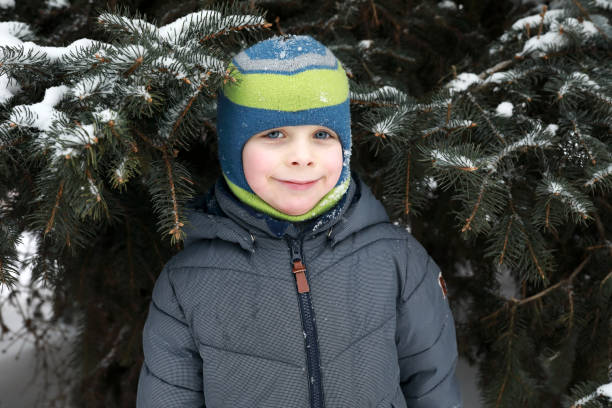istock Child on background of Christmas tree 1297213701
