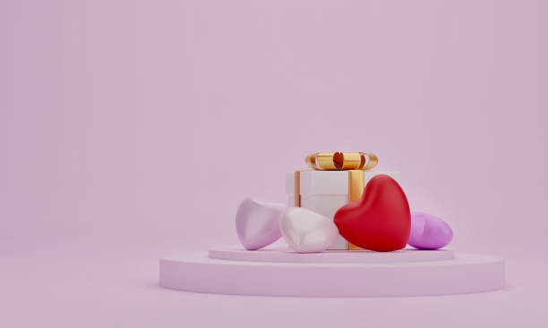 istock Gift box and heart on presentation podium with pink color background 1297215182