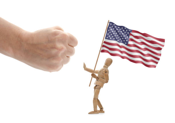 istock Wooden mannequin hold american flag and rejects interference 1297218907