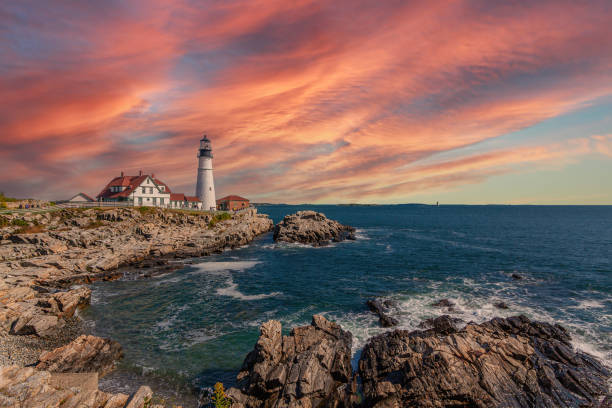istock Portland Head Light with Rocky Cliffs, Ocean Surf and Beautiful Sunset Sky. 1297220274