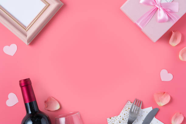 istock Valentine's Day design concept background with pink petals and gift box. 1297224620