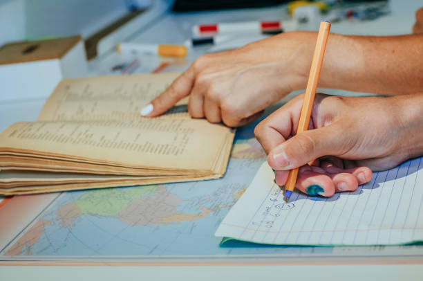 istock Boy doing his homework with his mother 1297226250