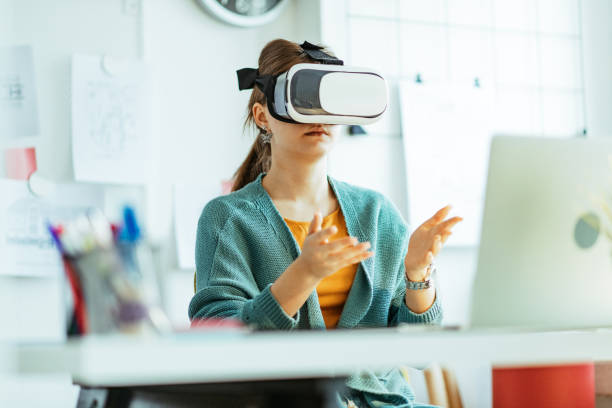 istock Female engineer working in office with VR glasses 1297226469