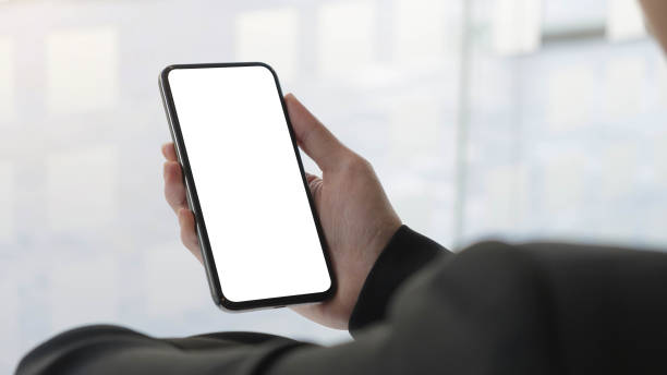 istock Close up Woman hand Using a Smart Phone with white screen at home. 1297227249