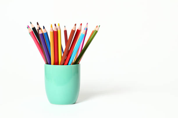 istock Water green pencil with many colored pencils and white background 1297227417