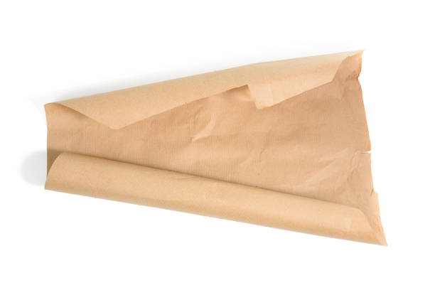 istock roll of brown wrapping paper isolated on a white background 1297231685