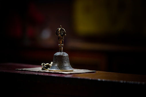 Tibetan bell and Vacra (also called Dorje or thunderbolt) in a buddhist monastery. Vajra is a Sanskrit word meaning both thunderbolt and diamond.