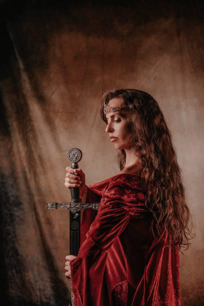 istock Medieval princess holding a sword in her hands 1297235933
