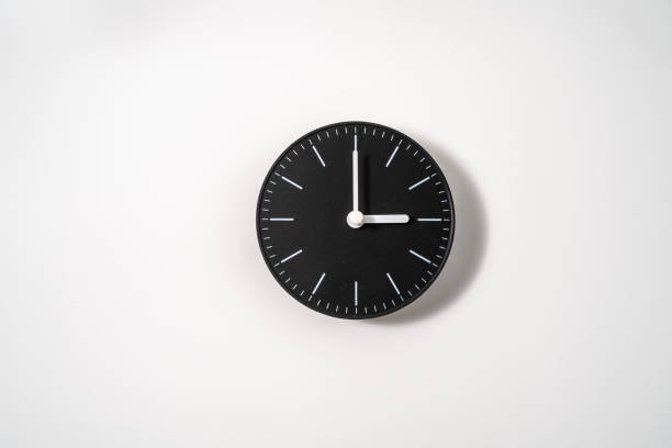 istock close up of an office clock on white background with clipping path 1297236624