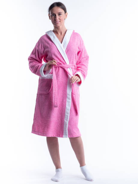 istock woman in a Bathrobe on an isolated white background with a smile on her face. 1297236800