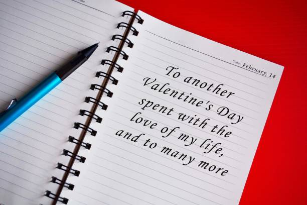 istock Text on white notepad with red background. Top view and Valentine's day concept. 1297237247
