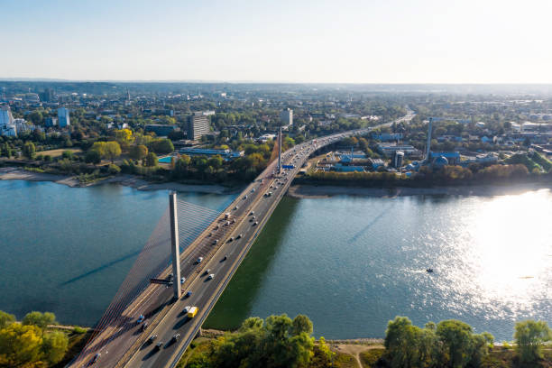 traffic running on modern bridge over Rhine river at late sunny afternoon