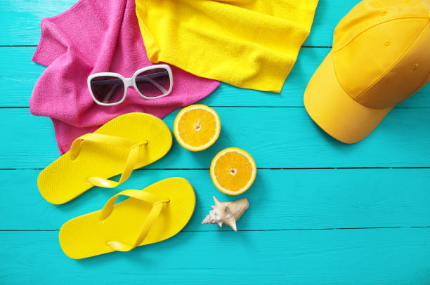istock Summer fun time and accessories on blue wooden background. Mock up and copy space 1297241498