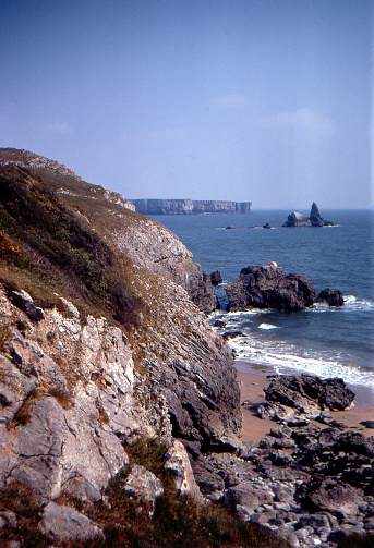 Surf and waves breaking on a rocky shore in Cornwall