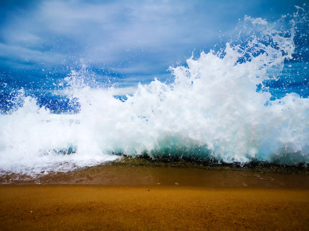 istock Ocean wave splashing up against the rocks and tidal pool 1297246786