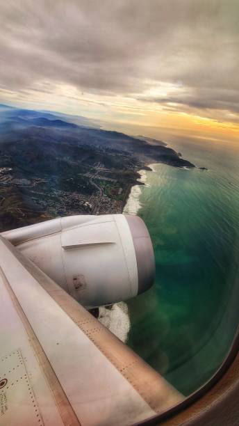 United Airlines Boeing 787-8 climbing out of SFO Pacific ocean bay area stock photo