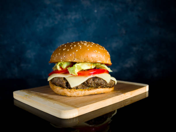 istock a Closeup of hamburger served on a wooden surface 1297247858