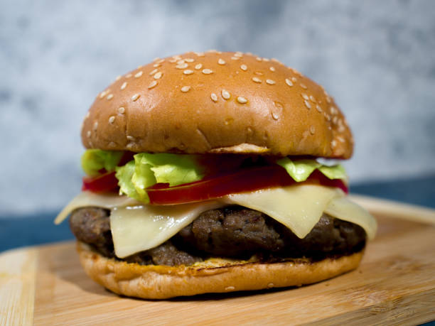 istock a Closeup of hamburger served on a wooden surface 1297247896