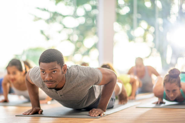 istock Doing planks in fitness class 1297247998