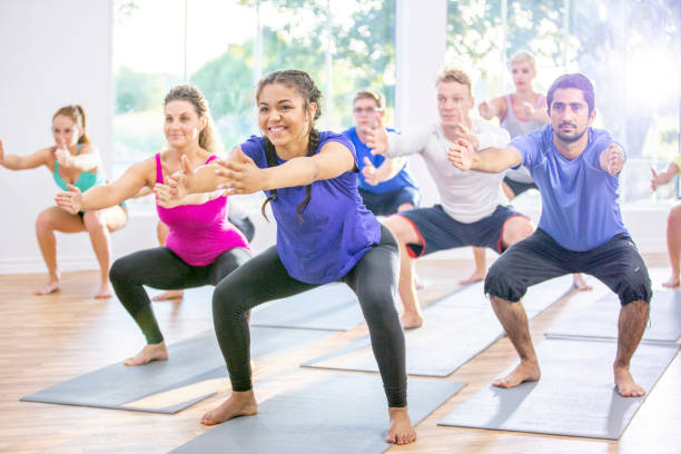 istock Working the quads in fitness class 1297248000