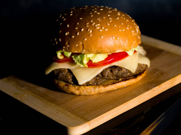 istock a Closeup of hamburger served on a wooden surface 1297248067