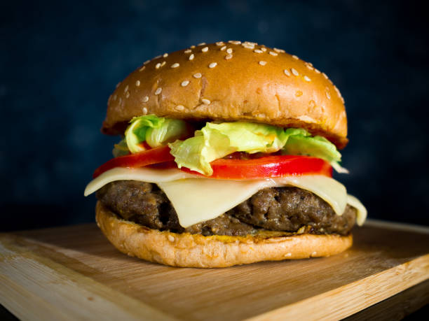 istock a Closeup of hamburger served on a wooden surface 1297248145