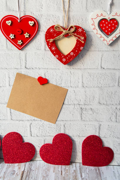 istock decorative red valentine and craft card for text on white brick background. valentines day concept 1297248622