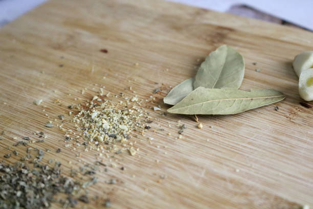 istock Herbs and Spices on a Wooden Cutting Board 1297249593