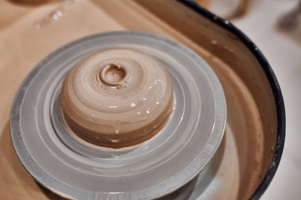istock Potter's wheel with raw clay in a pottery workshop 1297249865