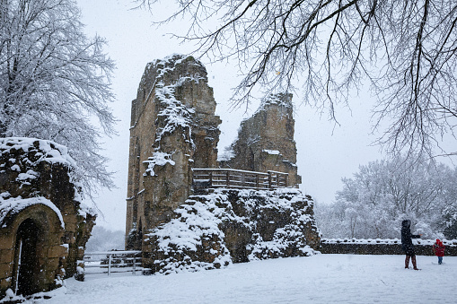 Winter snow over the river Nidd and famous landmark railway viaduct in Knaresborough, North Yorkshire.